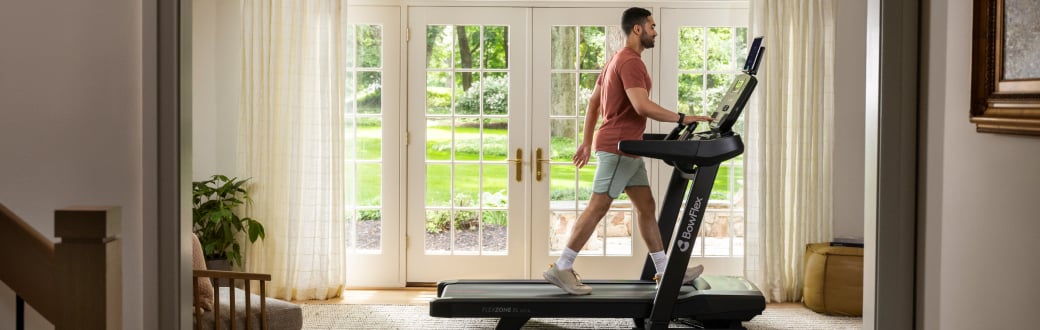 Man walking on a bowflex t9 treadmill