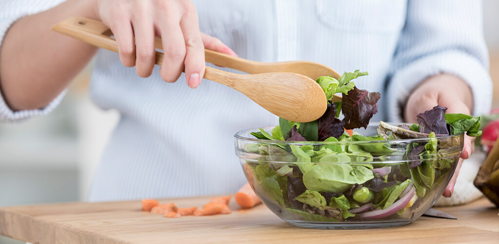 lettuce being tossed