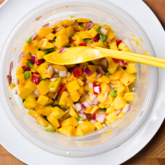 Mango cilantro salsa in a clear bowl.