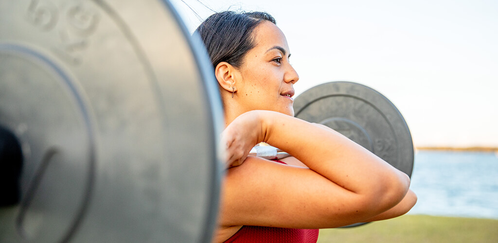 A woman using a barbell