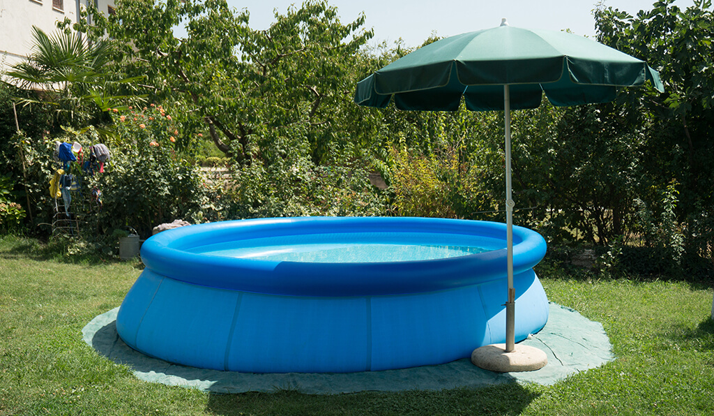 above ground pool in a backyard