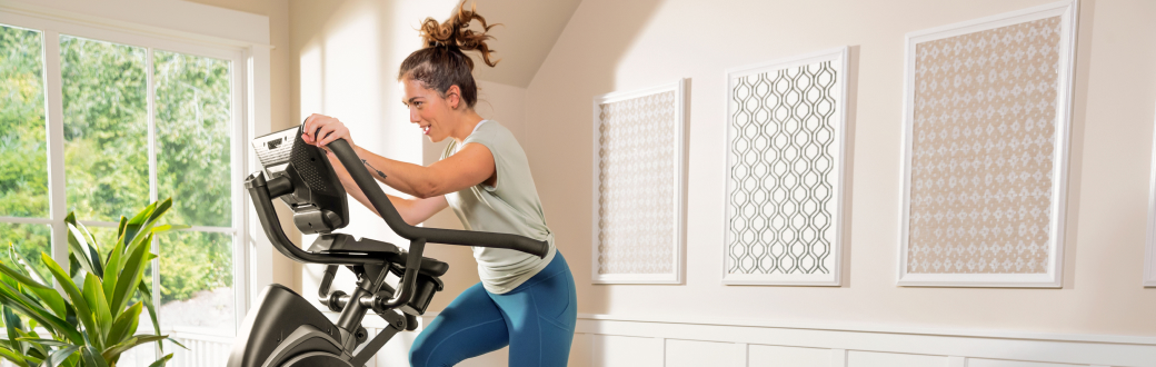 woman using a bowflex maxtrainer